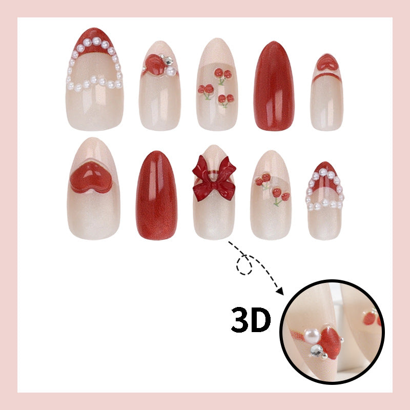 Artificial nail set with romantic berry designs and glamorous embellishments Stornfield