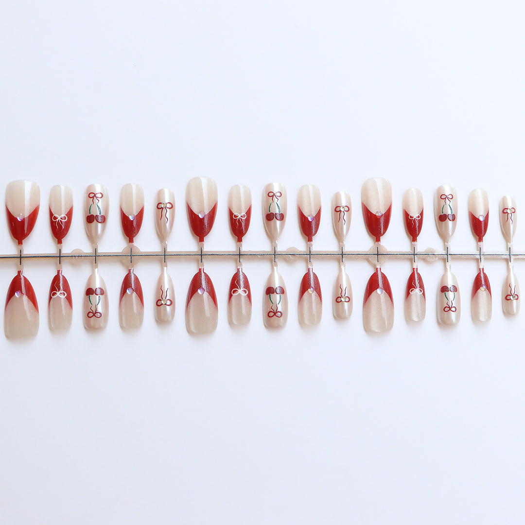 Artistic Press-On Nail Set with Cherry and Ribbon Design Stornfield