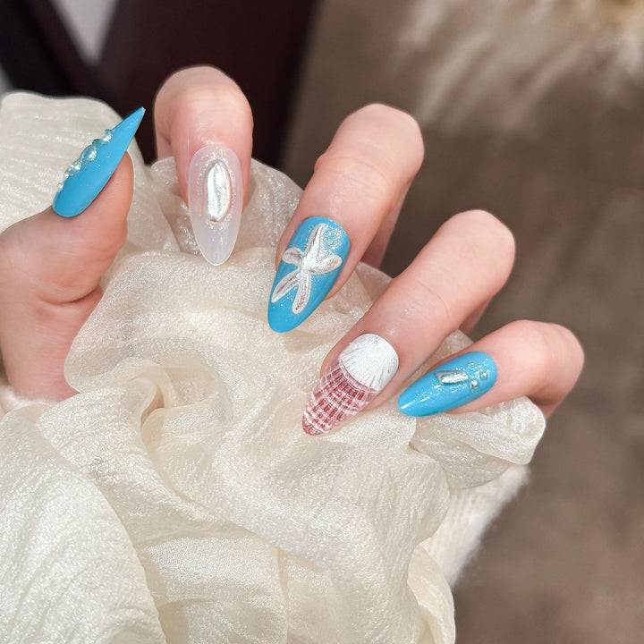Artistic Press-On Nail Set with Ocean-Themed Designs