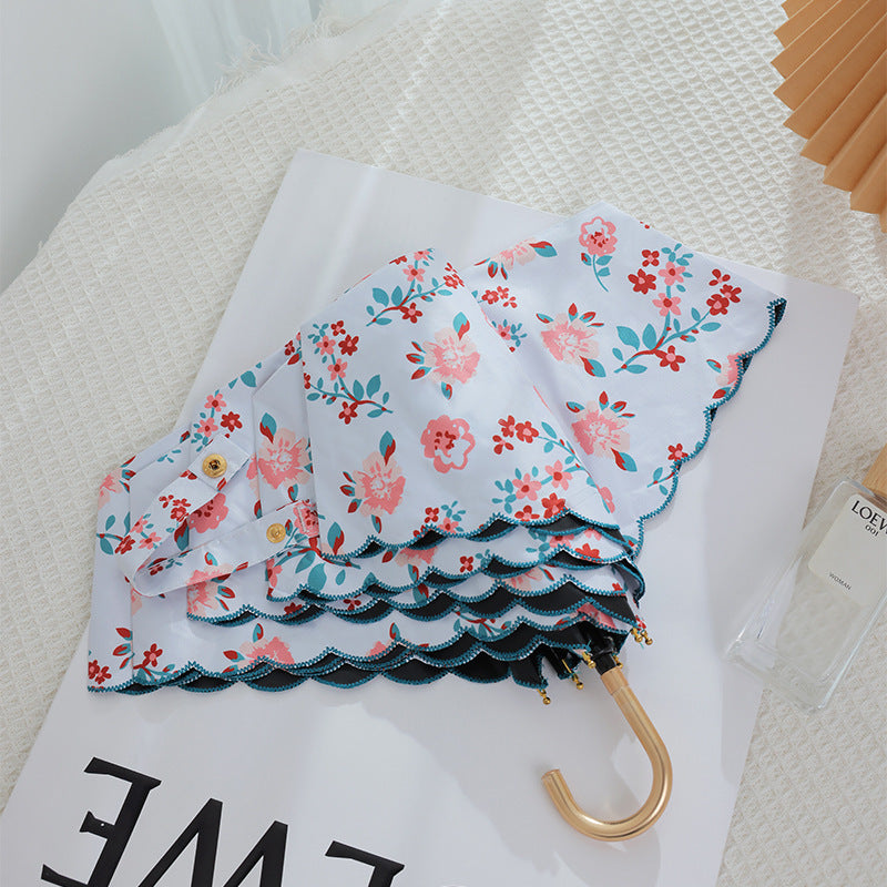 Women's elegant automatic folding umbrella with floral details Stornfield