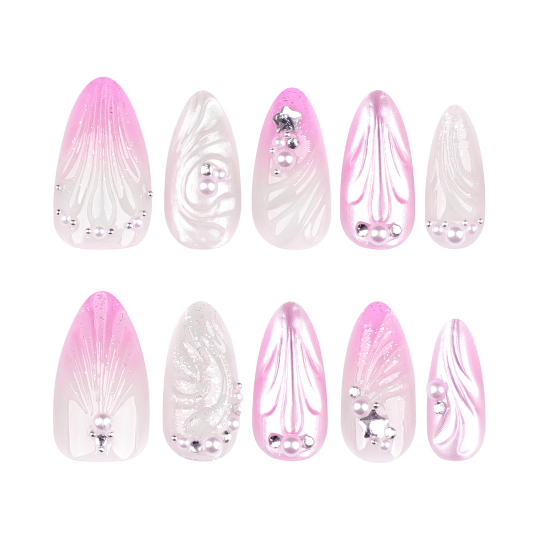 Artificial nail art with elegant swirl design and pearl embellishments Stornfield