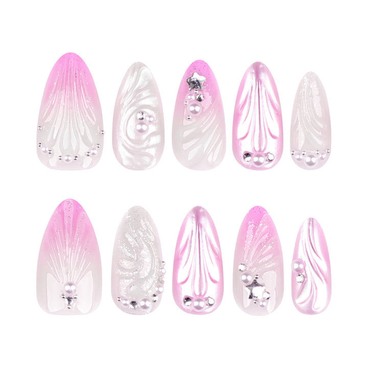 Artificial nail art with elegant swirl design and pearl embellishments Stornfield