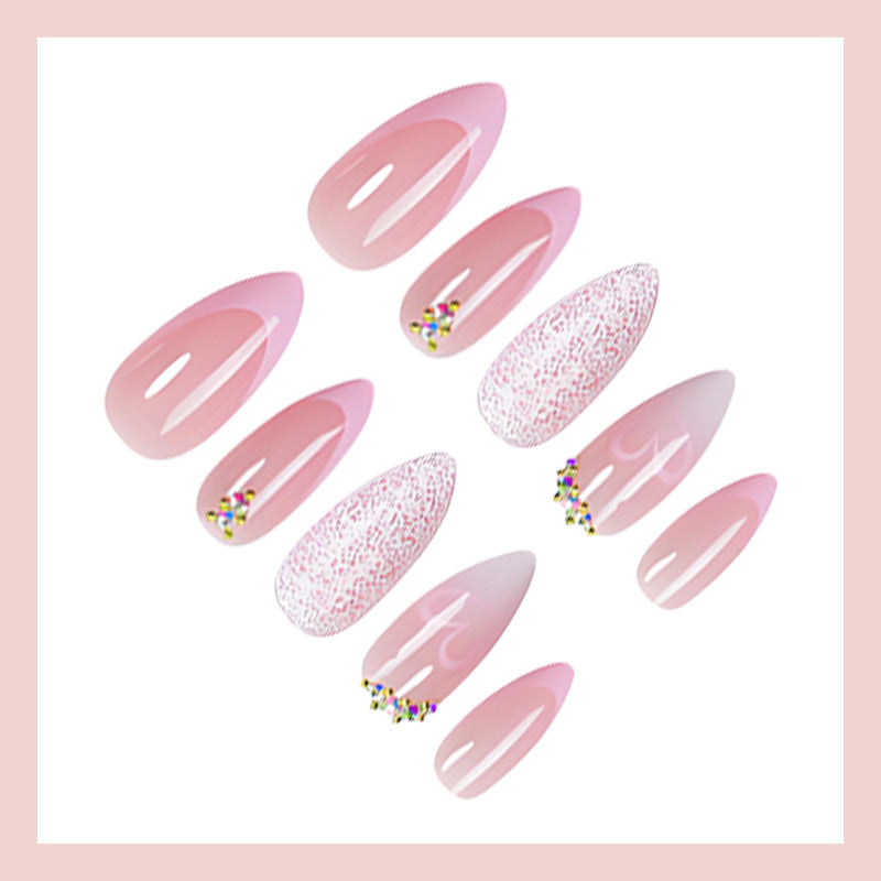 Artificial nail set with delicate glitter and heart designs Stornfield