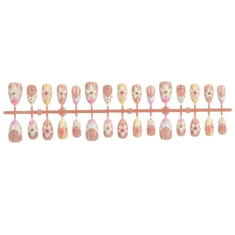 Nail art set with elegant floral design and glitter accents Stornfield