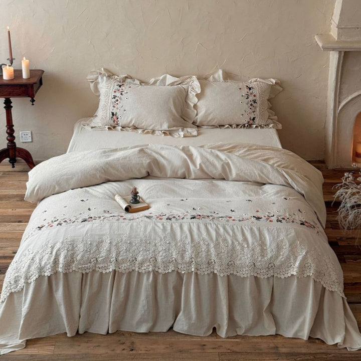 Romantic bedding set in country house style with embroidered border, frill and lace appliqué
