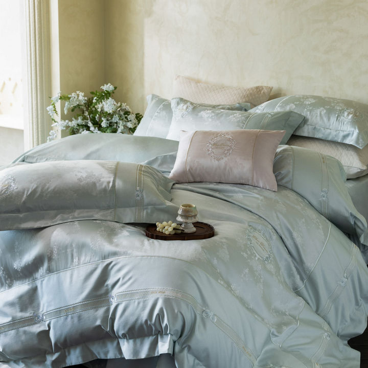 Luxurious satin bedding set with embroidered medallions and elegant quilting
