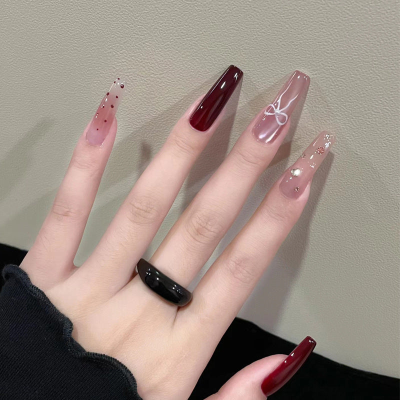 Artistic Long Press-On Nails Set with Glossy and Decorative Accents Stornfield