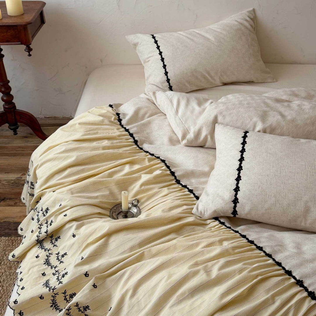 Bedding set with gathered bed skirt, embroidered trim and cotton-linen mix