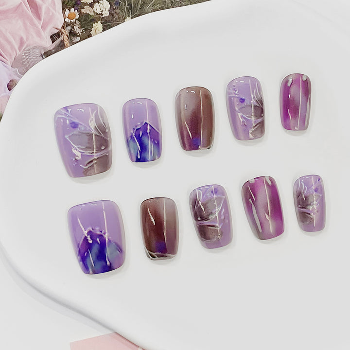 Artful acrylic nails with marbled design Stornfield