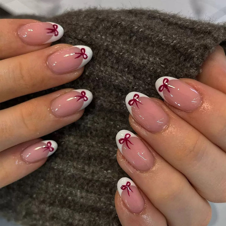 Artificial nail set with elegant bows and French tips Stornfield
