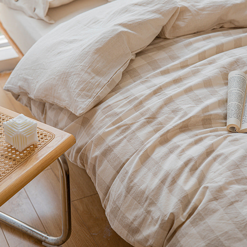 Reversible linen look duvet cover with large check pattern and wooden button closure