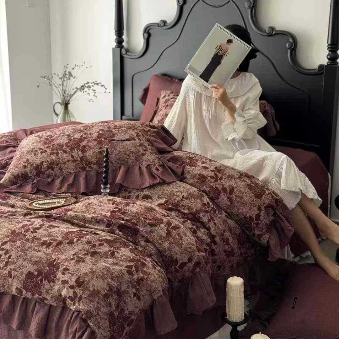 Quilted bed set in vintage look made from cotton blend with velvety floral pattern appearance and ruffle