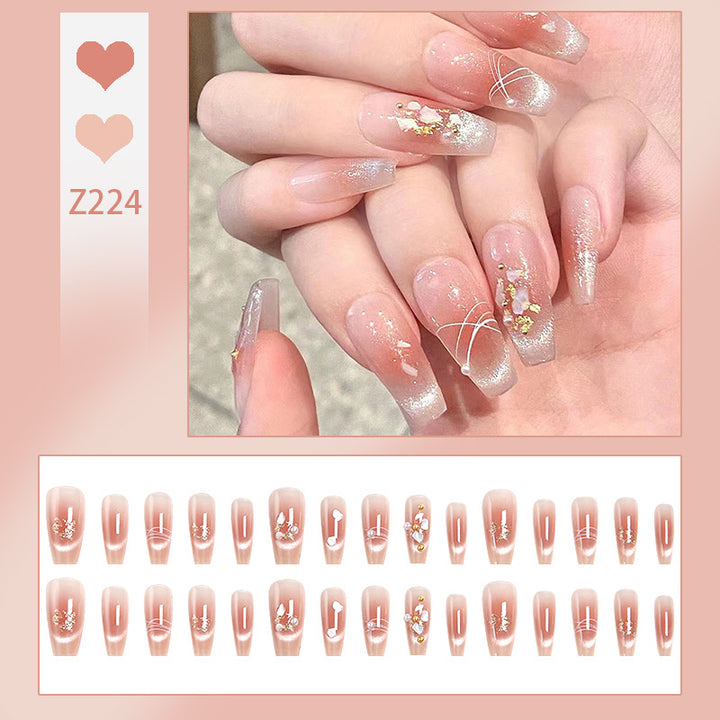 Artificial nail set with elegant glitter and flower decorations Stornfield
