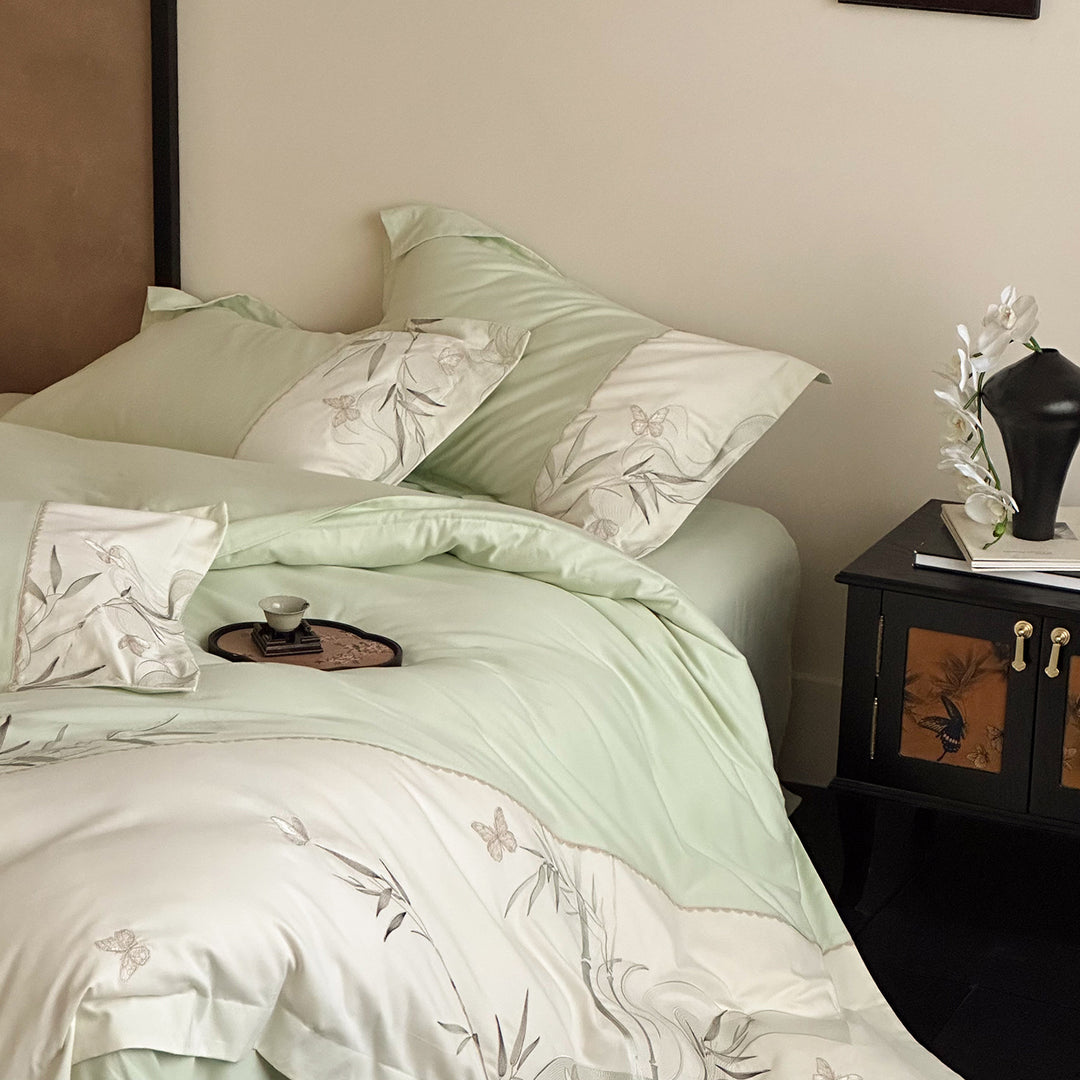 Elegant cotton satin bedding set with embroidered bamboo and butterfly border