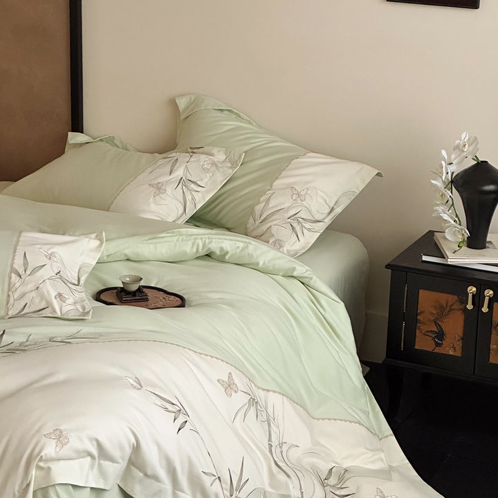 Elegant cotton satin bedding set with embroidered bamboo and butterfly border