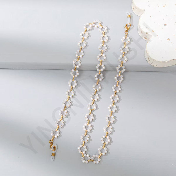 Elegant Pearl and Gold Chain Eyewear Holder Stornfield