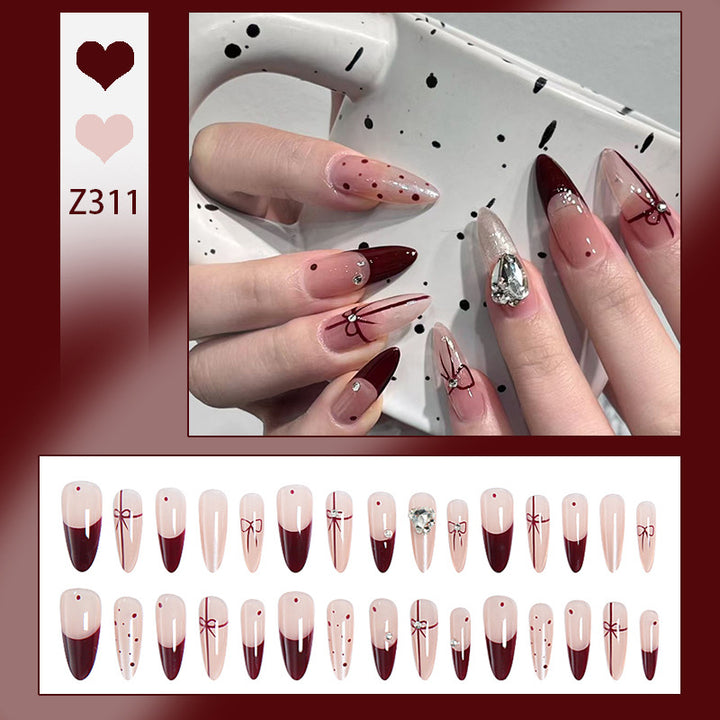 Artificial nail set with elegant bow and glitter details Stornfield