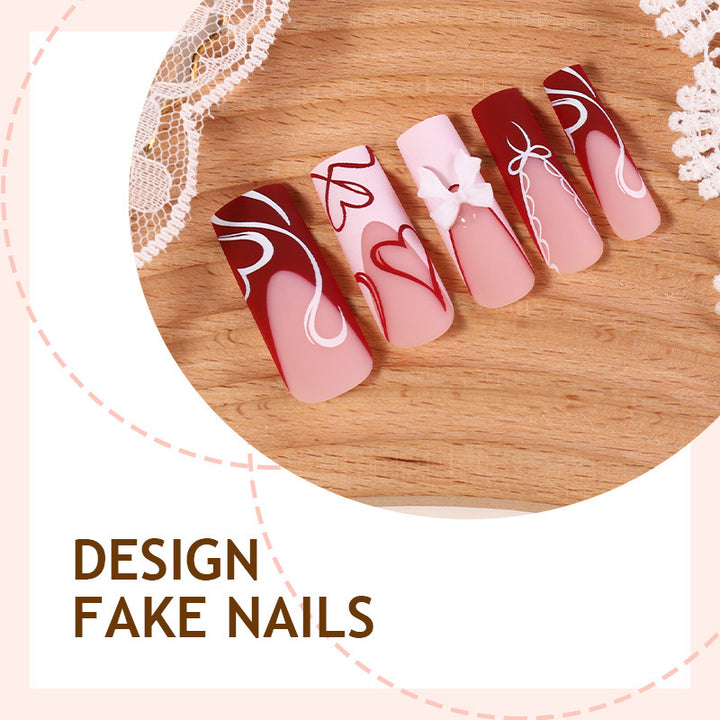 artistic nail set with heart and bow motifs Stornfield