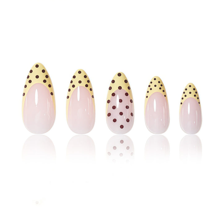 Elegant French Tip Nail Enhancements with Polka Dot Design Stornfield