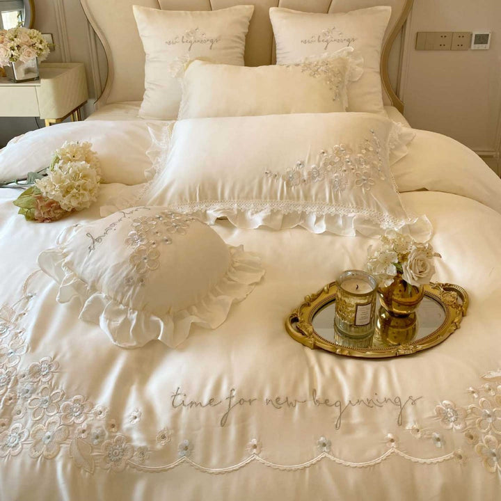 Romantic cotton satin bedding set with ruffles, floral embroidery, and satin bows