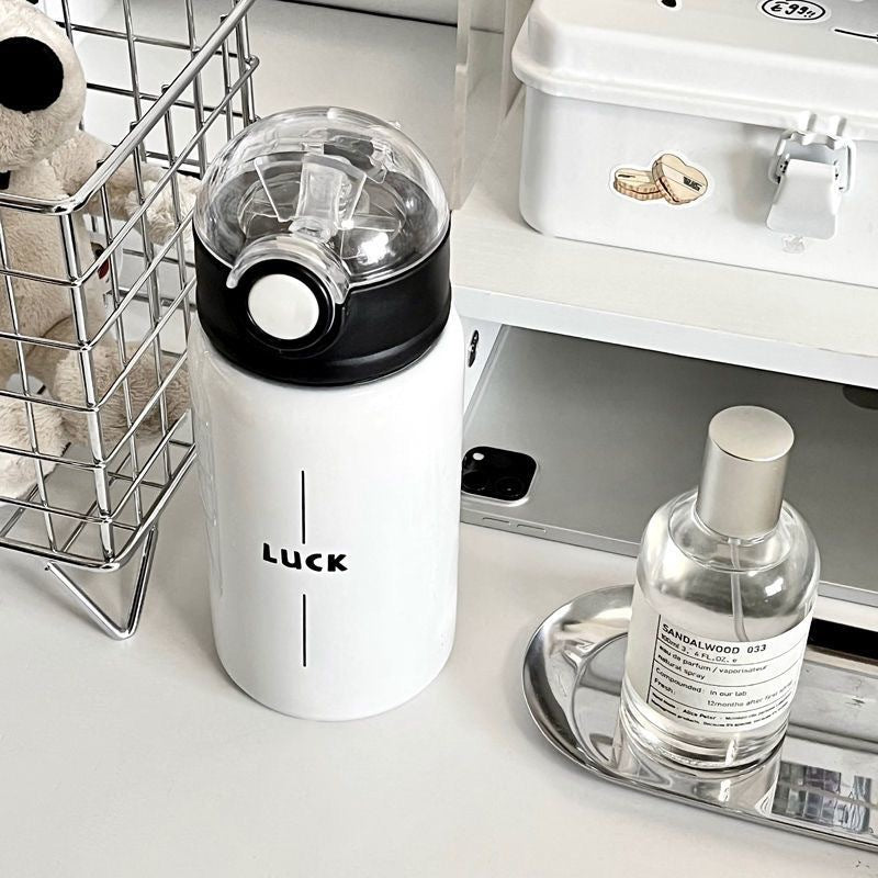 Women's insulated drinking bottle with innovative flip lid and practical handle Stornfield