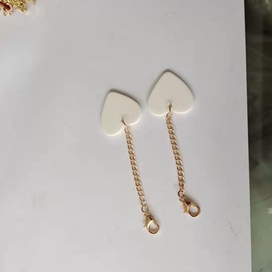 Heart-Shaped Dangle Earrings with Golden Chain Stornfield
