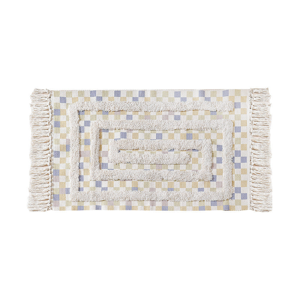 Hand-tufted bathroom mat with fringes, decorative dot-and-dash pattern and non-slip backing Stornfield