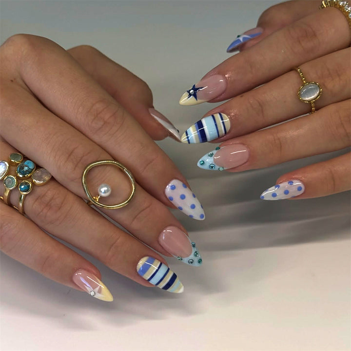 Artful stiletto nails with maritime designs Stornfield