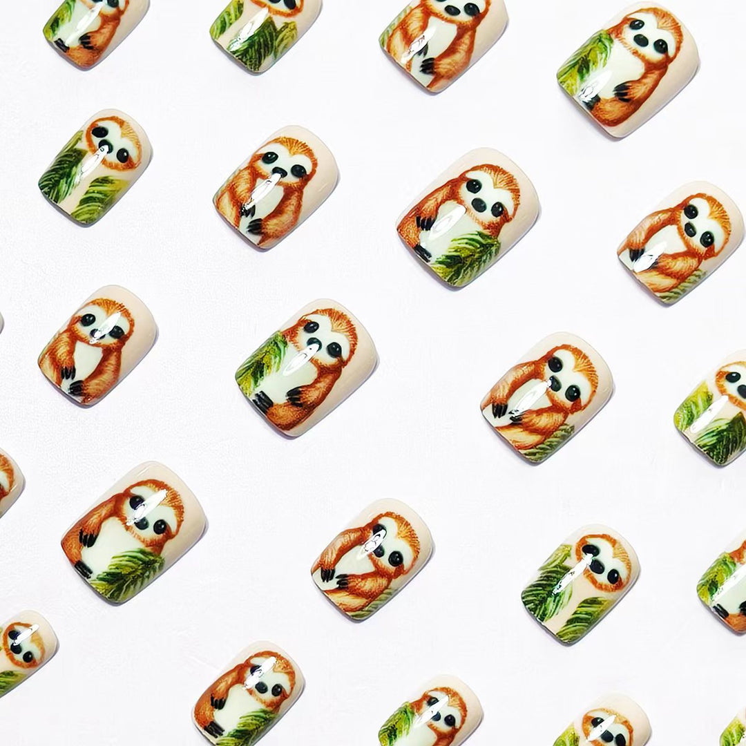 Art nails with cute sloth and leaf design Stornfield