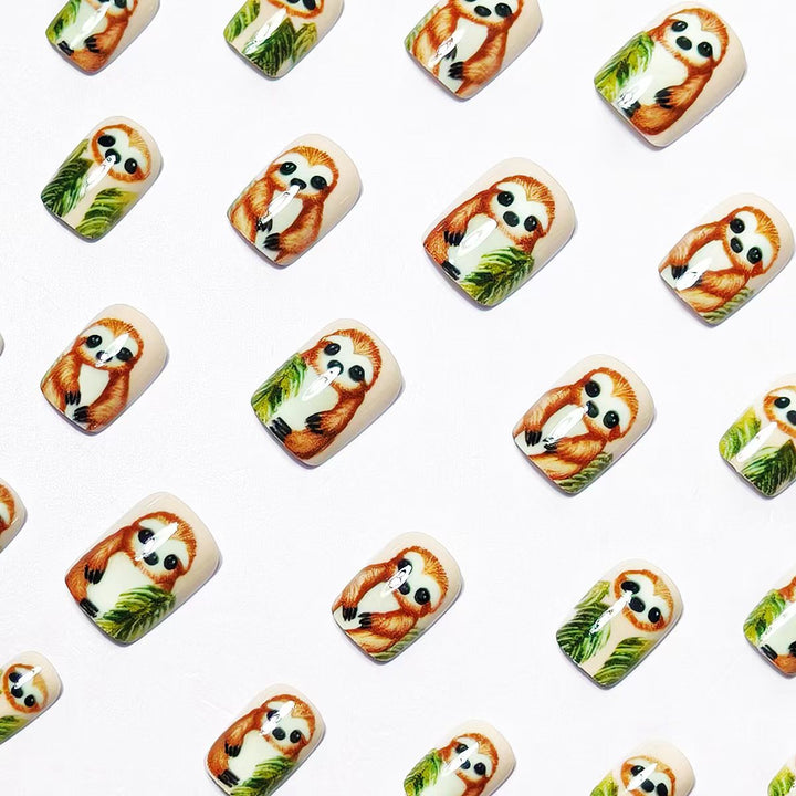 Art nails with cute sloth and leaf design Stornfield