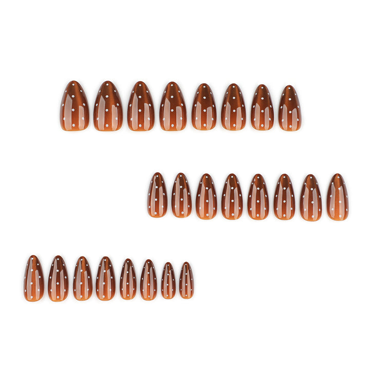 Artful nail extensions with glossy ombre effect and elegant dots Stornfield