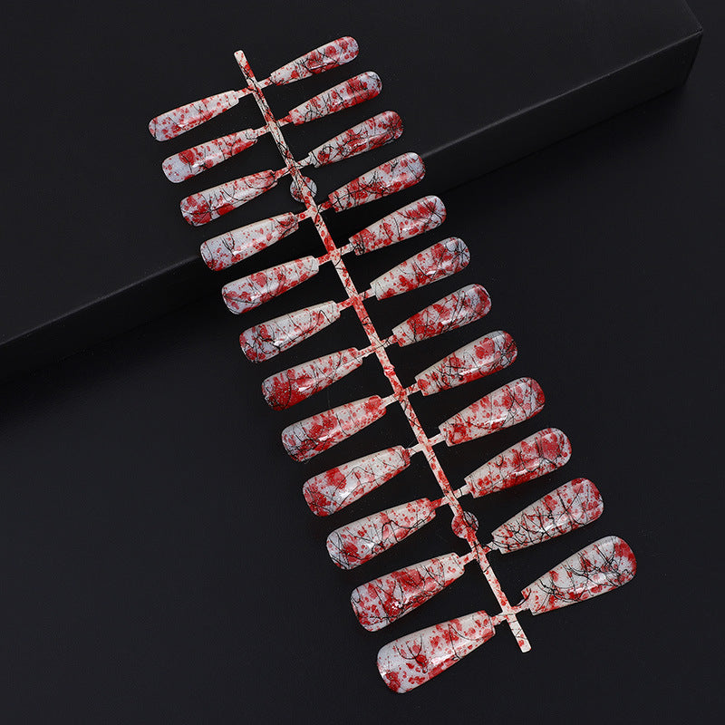 Creative nail art with blood splatter design Stornfield
