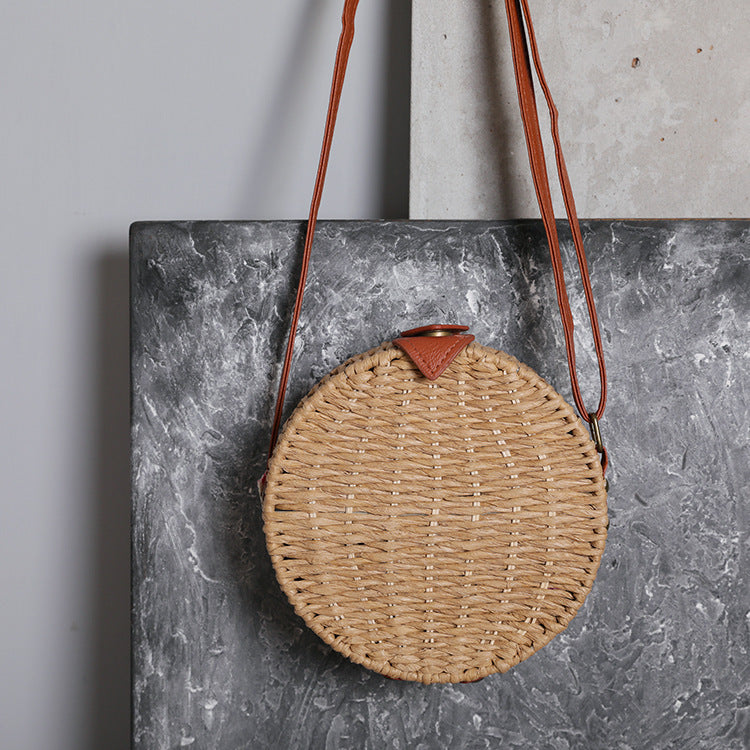 Round basket bag with leather accents Stornfield