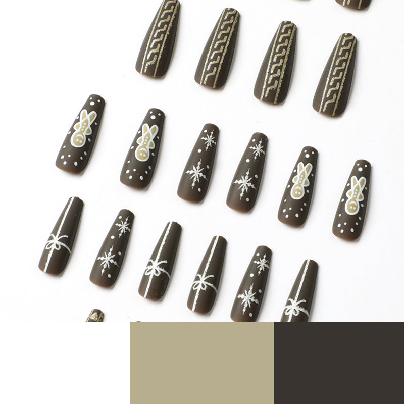 Artificial nail art with festive gingerbread design Stornfield