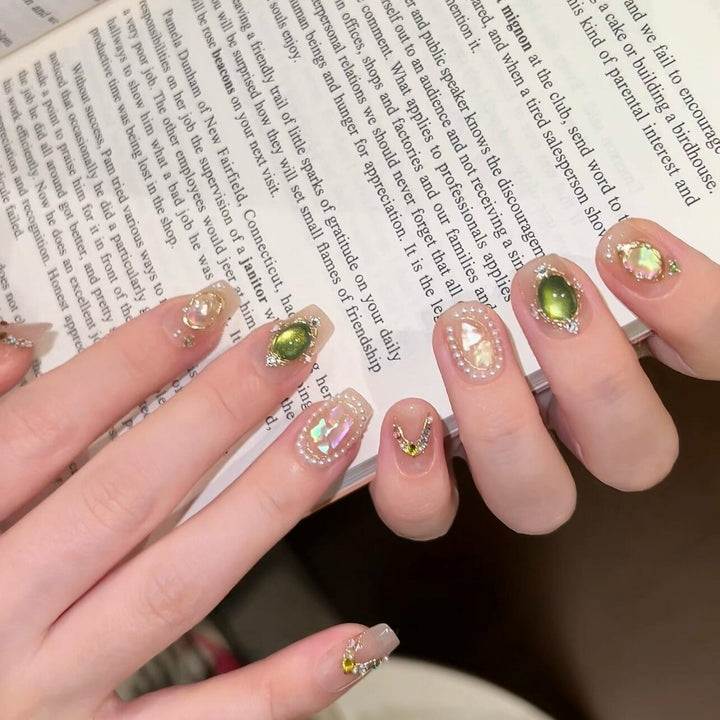 Artificial nails with rhinestone and pearl accents Stornfield