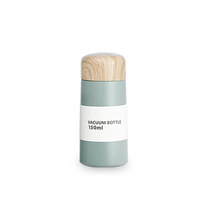 Women vacuum-insulated water bottle with innovative wooden lid Stornfield