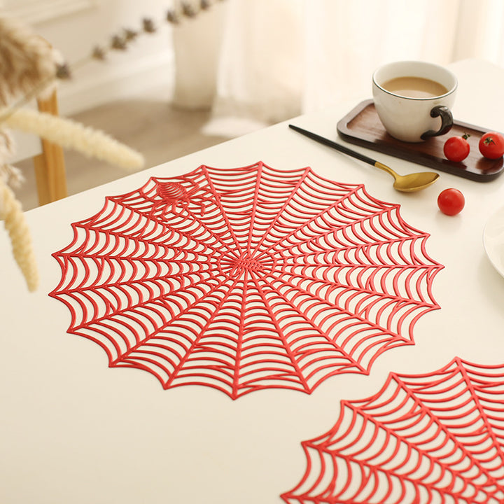 Round filigree spider web placemat made of heat- and water-repellent PVC for table decoration