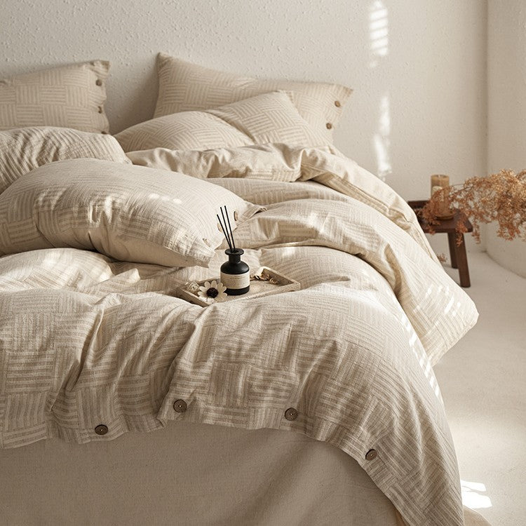 Linen-look bedding set with natural wood button closure and fine texture