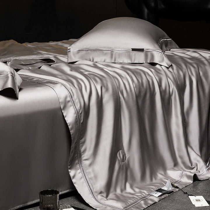 Luxurious satin bed set with silk-like surface and fine decorative stitching