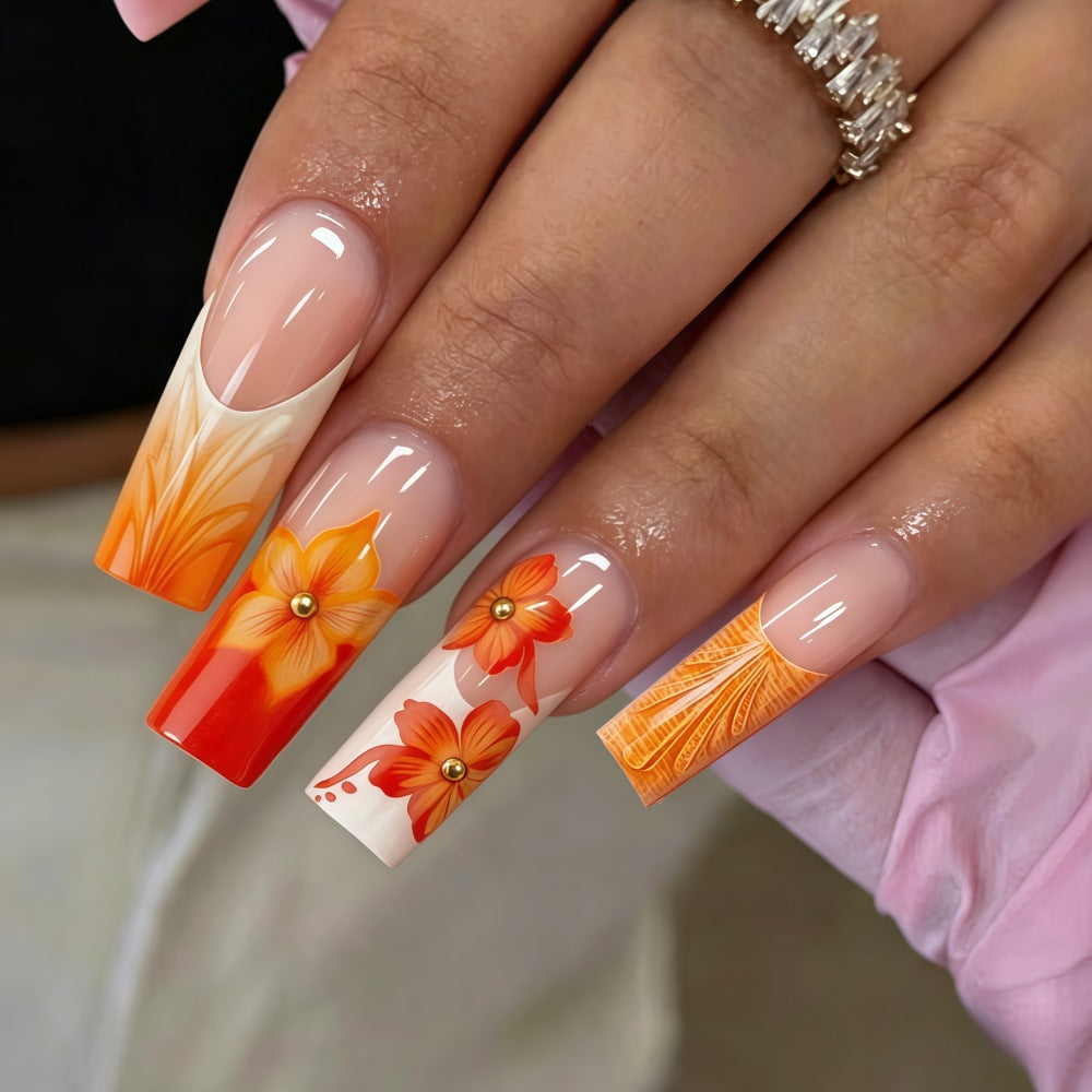 Nail art with floral accents and glitter Stornfield