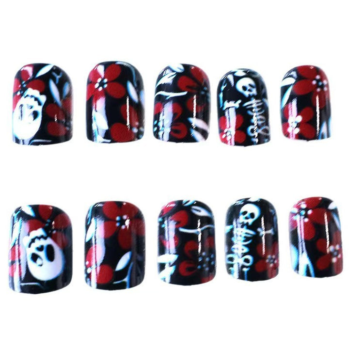 Creative nail art with skull motif and floral elements Stornfield