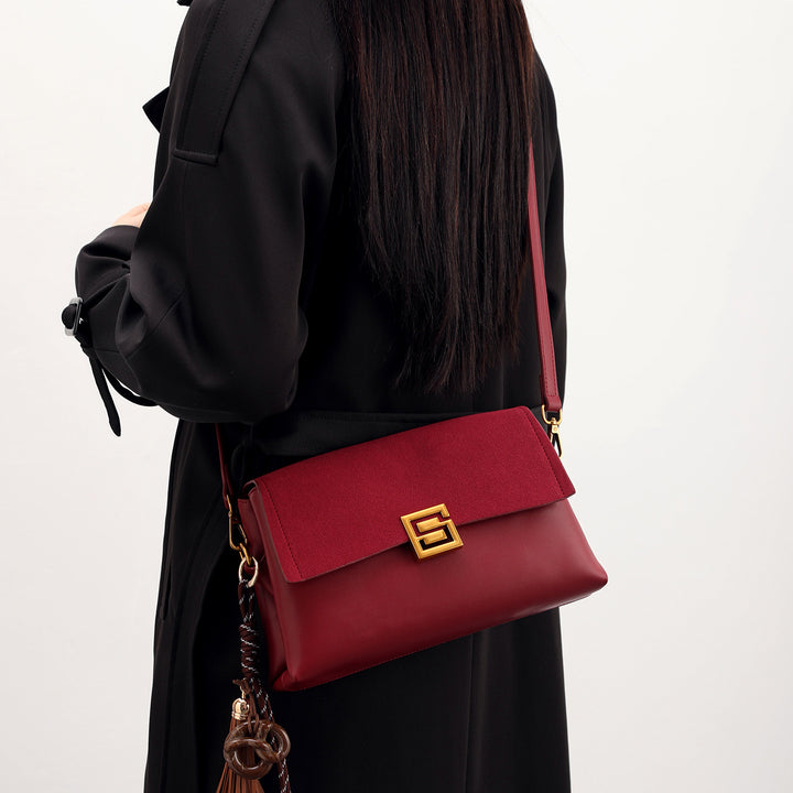 Elegant Suede Handbag with Gold Accents