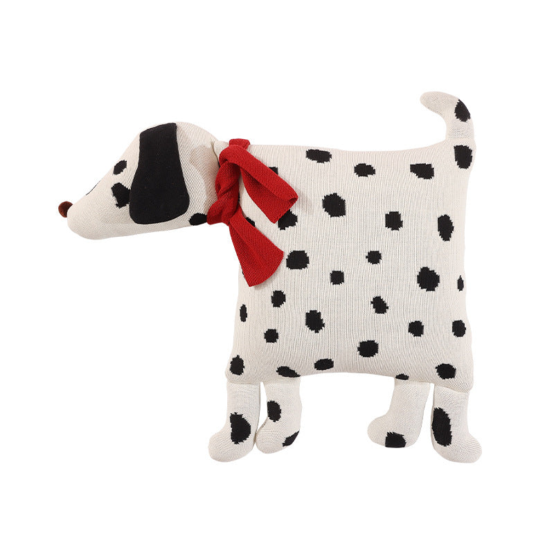 Decorative knitted cuddle pillow in the shape of a dog with a quilted body and bow detail Stornfield