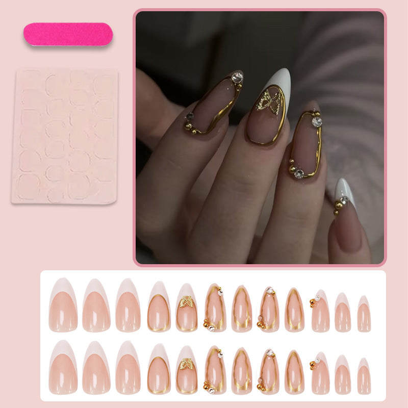 Artificial nail set with elegant gold accents and luxurious decorations Stornfield