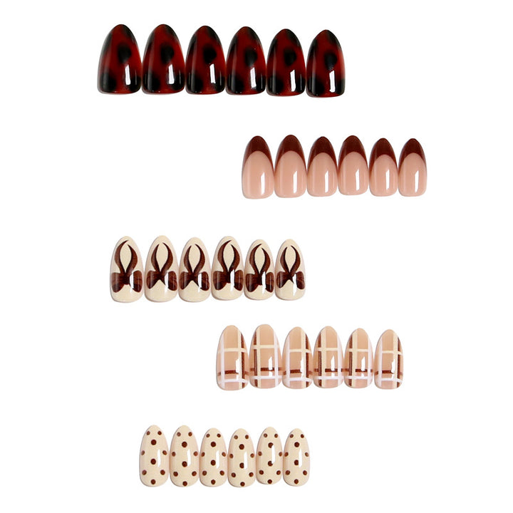Artificial nail set with elegant bow and caramel designs Stornfield