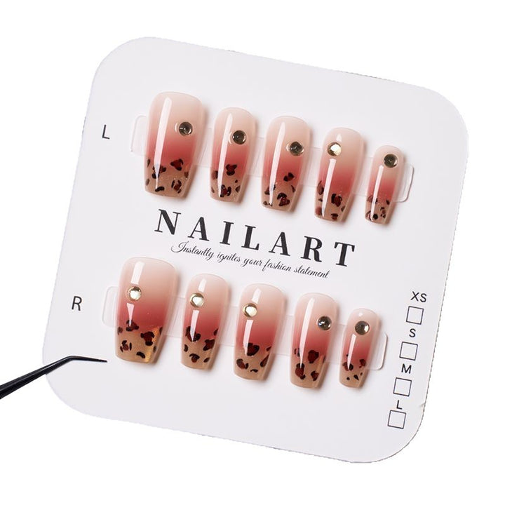 Artificial nails with elegant leopard pattern and glitter accents Stornfield