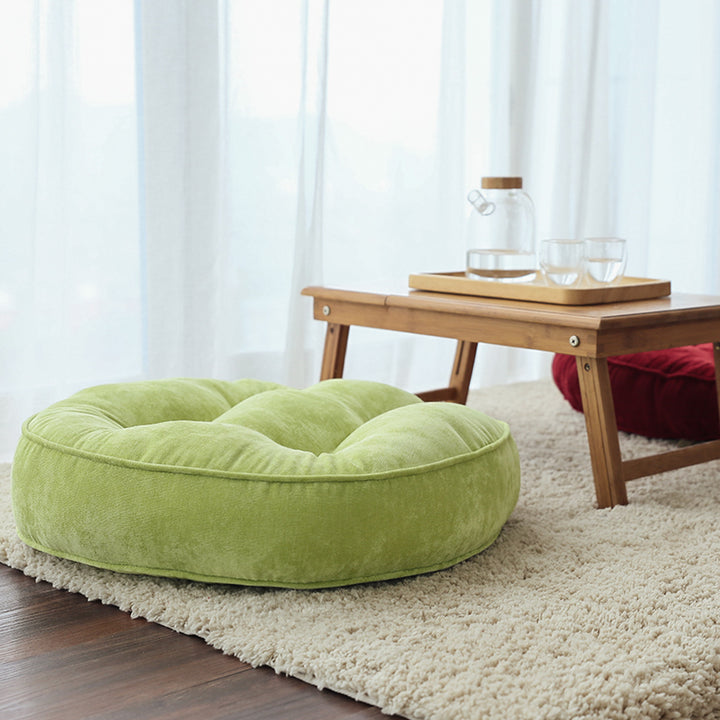 Round padded seat cushion with tufting and soft microfiber cover