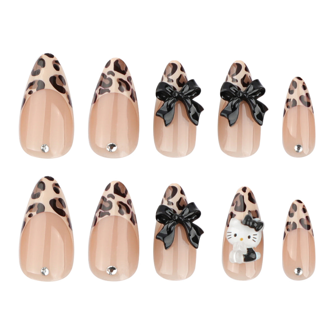 Artistic extension nails in leopard pattern with bow accents Stornfield