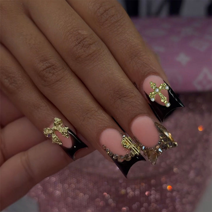 Artificial nails with elegant gold decorations and stylish black Stornfield