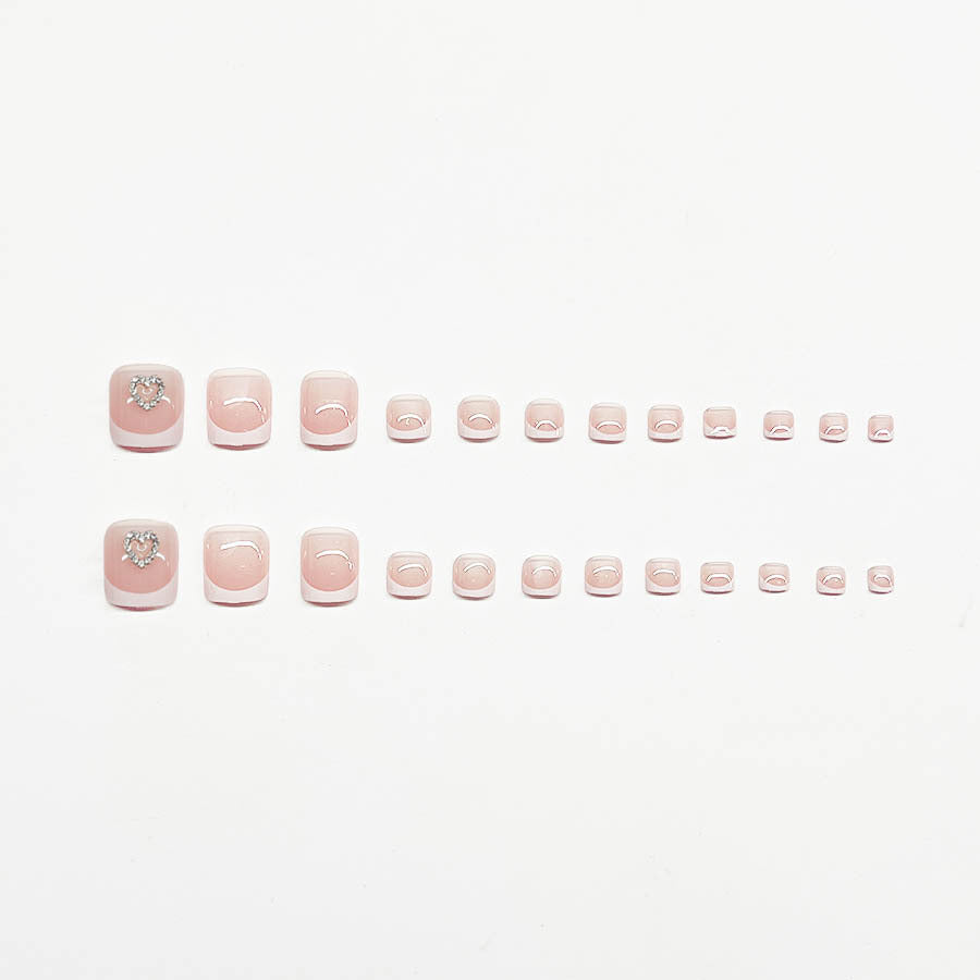 Acrylic nail set with playful heart design Stornfield